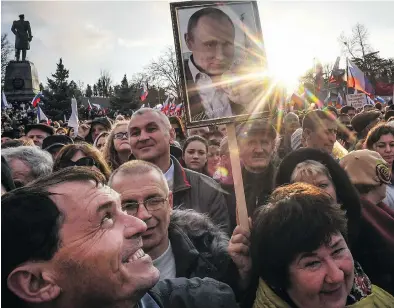  ?? YURI KADOBNOV / AFP / GETTY IMAGES ?? Supporters of Russian President Vladimir Putin gather for a rally to celebrate the fourth anniversar­y of Russia’s annexation of Crimea at Sevastopol’s Nakhimov Square on Wednesday.