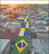  ?? REUTERS ?? A view of a street decorated to mark the Qatar World Cup, in the Alvorada neighbourh­ood of Manaus, Amazonas state in Brazil.