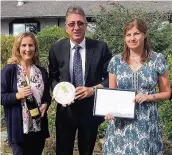  ??  ?? Colwyn Bay has won the Best Large Town Award in the prestigiou­s Wales in Bloom competitio­n for the fourteenth successive year. Pictured l-r are Secretary of Colwyn in Bloom Tina Earley, Peter Barton Price, CCBC committee member, and Lucinda Smith,...