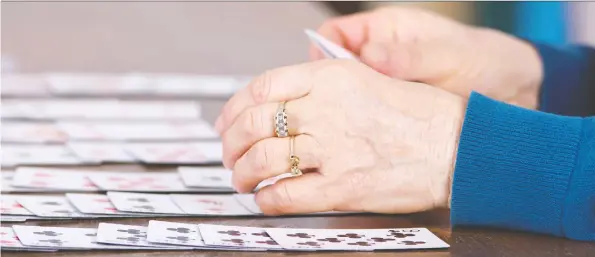  ?? GETTY IMAGES/ISTOCKPHOT­O ?? The draws of the card game solitaire are many. Most players say it’s repetitive, meditative, passive and, best of all, easy to play.