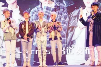  ?? (Reuters photo) ?? Members of China’s all-girl ‘boyband’ FFC-Acrush appear on the stage during their maiden press conference in Beijing, China April 28, 2017.