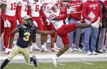  ?? ASSOCIATED PRESS ?? Cornerback Cam Taylor-britt (right), the Bengals’ second-round draft pick, signed his contract Friday. So did seventh-rounder Jeff Gunter, leaving only offensive lineman Cordell Volson and defensive lineman Zach Carter to get deals done.