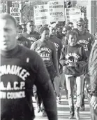  ?? MILWAUKEE JOURNAL ?? Members of the Youth Council of the Milwaukee chapter of the NAACP march down a south side street on Sept. 8, 1967. This photo was in the Sept. 11, 1967, Milwaukee Journal.