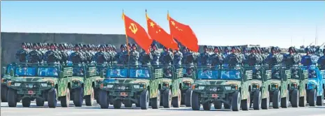  ?? WANG JIANHUA / XINHUA ?? A flag guard formation of the major military branches carry flags of the Party, the People’s Republic of China and the PLA on Sunday.