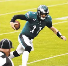  ??  ?? Carson Wentz scrambles for a touchdown during the second half against the Cincinnati Bengals on Sunday.