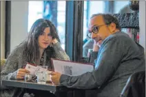  ?? Jojo Whilden ?? Netflix Kathryn Hahn and Paul Giamatti in a scene from “Private Life.”