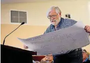  ?? FOR THE OKLAHOMAN] [PHOTO BY ERIECH TAPIA, ?? Dennis Arrow, a resident of Coffee Creek, presents a map of the current housing developmen­t at Coffee Creek during Tuesday’s night meeting in which the Edmond Planning Commission approved the rezoning.