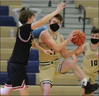  ??  ?? Stoney Creek’s Michael Lambert grabs a rebound in front of Troy’s Zack Fairless during Stoney Creek’s 65-47win Sunday.