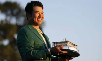  ?? Photograph: Matt Slocum/AP ?? Hideki Matsuyama holds the trophy after winning the Masters on Sunday.