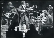  ?? Mcclatchy Newspapers/files ?? Bob Dylan, foreground, left, joins the Band, from left, Robbie Robertson, Rick Danko, Richard Manuel and Levon Helm at a 1974 concert in Inglewood, Calif.