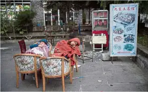  ??  ?? Safer in the open: Residents fearing aftershock­s sleeping outside their houses after an earthquake in Zhangzha town, Jiuzhaigou county. — AFP