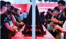  ?? ?? Escape … fans play Super Smash Bros on Nintendo Switch at the E3 2018 in Los Angeles. Photograph: Frederic J Brown/AFP/ Getty Images