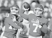  ?? Brian Bahr / Getty Images ?? Spencer Rattler, right, started the season as the Heisman favorite but struggled this season and said he’ll transfer.