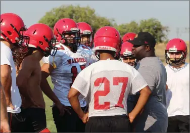  ?? MIKE BUSH/NEWS-SENTINEL ?? Galt High football coach Jermaine Allen talks to his players during preseason practice in late summer of last year.