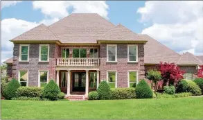  ?? PHOTOS BY LINDA GARNIER-BUNCH/Arkansas Democrat-Gazette ?? This all-brick home offers four living spaces, as well as four bedrooms, three-and-ahalf baths and an abundance of extra amenities. The privacy-fenced backyard is overlooked by a shaded porch.