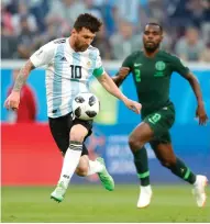  ?? Ricardo Mazalan/ Associated Press ?? Argentina's Lionel Messi controls the ball during the group D match between Argentina and Nigeria on Tuesday at the 2018 World Cup in the St. Petersburg Stadium in St. Petersburg, Russia.