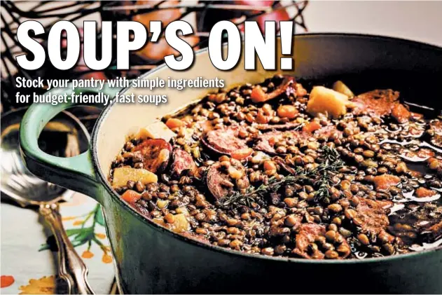  ?? E. JASON WAMBSGANS/CHICAGO TRIBUNE; SHANNON KINSELLA/FOOD STYLING ?? The lentil stew is studded with carrots, potatoes and smoked sausage.