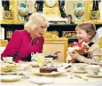  ?? ?? The Queen shared tea and scones with Olivia, who has grade-one brain tumour