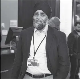  ?? CP PHoTo ?? Defence Minister Harjit Sajjan heads to the morning session as the Liberal cabinet meets in St. John’s, N.L. on Wednesday.