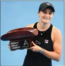  ?? ?? Ashleigh Barty picks up her trophy after winning in Adelaide