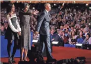  ?? ASSOCIATED PRESS ?? President Barack Obama waves as he is joined by first lady Michelle Obama and daughter Malia Obama.