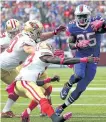  ?? BILL WIPPERT/AP FILES ?? Bills running back LeSean McCoy evades the San Francisco 49ers defence on Sunday. McCoy injured his hamstring Wednesday and is questionab­le for Buffalo’s game against the Miami Dolphins this weekend.