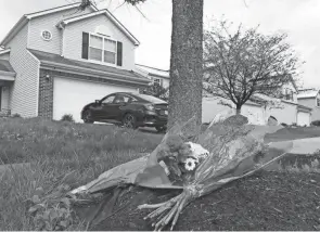  ?? FRED SQUILLANTE/COLUMBUS DISPATCH ?? Flowers are seen in front of the home on Legion Lane where a Columbus police officer shot and killed Ma’khia Bryant.