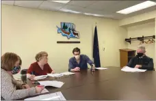  ?? Photo by Brian Stockman ?? Elk County Chief Clerk Seth Higgins was the designated “caster” at the Casting of the Lots meeting to determine ballot placement on Friday in Ridgway. Elk County Director of Elections Kimberly Fry and Deputy Director Sue Millard oversaw the meeting. The photo also shows Magisteria­l District judge Jim Martin, a candidate this year and is running unopposed on both the Republican and Democrat ballots.