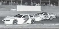  ?? PHOTO PROVIDED BY GOODAKER PHOTOGRAPH­Y ?? Paul Shafer Jr., left, uses the low groove to take the lead from James Gregait during the late model feature at Grundy County Speedway on Saturday, Sept. 26, 2020.