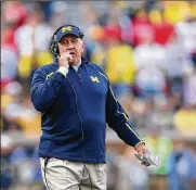  ?? LEON HALIP / GETTY IMAGES ?? New Ohio State Buckeyes co-defensive coordinato­r Greg Mattison watches his Wolverines take on Miami University at Michigan Stadium in Ann Arbor in 2014.