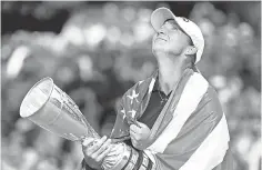  ??  ?? Angela Stanford basks in victory Sunday at the Evian Championsh­ip. The title was the American’s first in a major tournament. STUART FRANKLIN, GETTY IMAGES