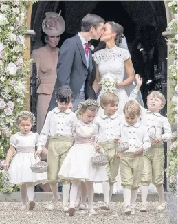  ??  ?? Pippa Middleton and James Matthews kiss after their wedding and, below, princes William and Harry and sister Kate