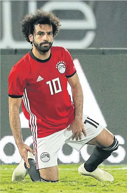  ??  ?? Egypt’s Mohamed Salah reacts after sustaining an injury against eSwatini.