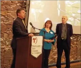  ?? REBECCA BLANCHARD — DIGITAL FIRST MEDIA ?? State Rep. David Maloney presents Susan Lopez and Russ Phillips of the Boyertown Community Library with a certificat­e of recognitio­n during the annual Boyertown Area Progress Dinner Jan. 17.