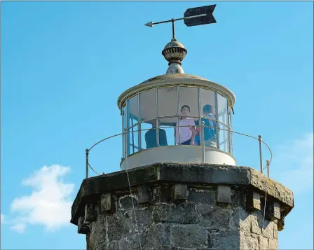  ?? PHOTOS BY DANA JENSEN/THE DAY ?? After the celebratio­n Saturday for the restoratio­n that will take place at the Old Lighthouse Museum in Stonington, Lindsey Houle, 12, and others look at the view from the top of the lighthouse.