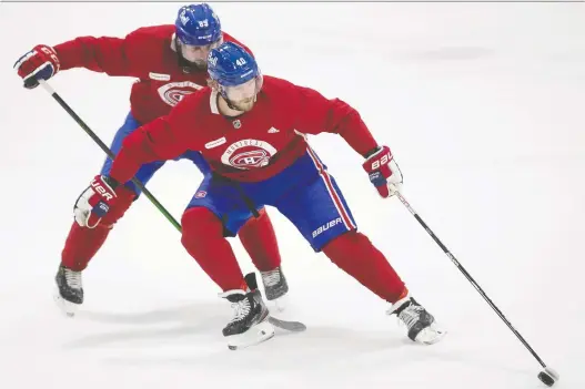  ?? PIERRE OBENDRAUF ?? Joel Armia, foreground, and Terrance Amorosa take part in drills on Thursday during first day of the Canadiens' on-ice training camp.