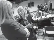  ??  ?? U.S. Rep. Marsha Blackburn talks with Tennessee Farm Bureau Executive Vice President Rhedona Rose before speaking to members of the agricultur­e community Aug. 24 in Nashville. Blackburn is the Republican candidate in the U.S. Senate race. MARK ZALESKI/FOR THE TENNESSEAN