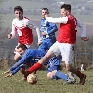  ??  ?? Richard Farrell of Moyne Rangers goes past Richie O’Hara of Tombrack United.