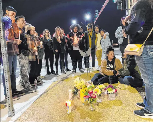  ?? David Wilson
Las Vegas Review-journal ?? Family and friends of Corinthian Nordahl gather at the corner of West Russell Road and South Buffalo Drive on Thursday. Nordahl, 29, a motorcycli­st, died in a three-vehicle collision there Tuesday.