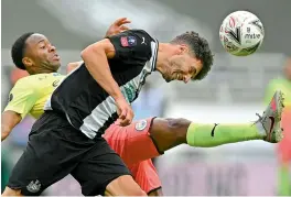  ?? AP ?? Manchester City’s Raheem Sterling (left) challenges Fabian Schaer of Newcastle United during their FA Cup sixth round match at St James Park in Newcastle, England, on Sunday. City won the match 2-0. —