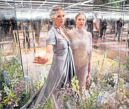  ??  ?? Kate Moss, left, and daughter Lila Grace Moss model for Fendi at Paris Fashion Week on Wednesday