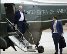  ?? SUSAN WALSH -THE ASSOCIATED PRESS ?? White House Chief of Staff John Kelly, left, walks off of Marine One as White House aide Johnny DeStefano, right, waits, as they arrive at Andrews Air Force Base in Md., with President Donald Trump, Friday