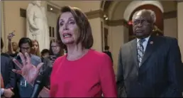  ??  ?? Speaker of the House Nancy Pelosi, D-Calif. (center) joined at right by Majority Whip James Clyburn, D-S.C., pushes back on President Donald Trump’s demand to fund a wall on the US-Mexico border with the partial government shutdown in its second week, at the Capitol in Washington, on Thursday. AP PHOTO/J. SCOTT APPLEWHITE