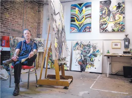  ?? ROBERTO E. ROSALES/JOURNAL ?? Painter Earl McBride relaxes in his Albuquerqu­e studio at the Factory on Fifth.