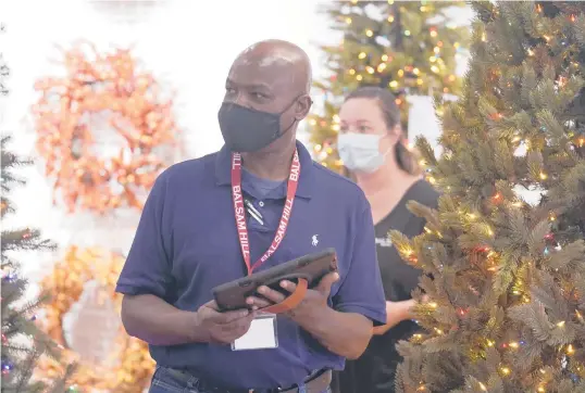  ?? LM OTERO/AP ?? Balsam Hill Outlet sales associate Rickey Haynes trains with manager Kelly Bratt last month in Allen, Texas. Haynes landed a part-time job that allows him to continue preaching on Sundays. More hourly employees are seeking flexibilit­y in when they work.