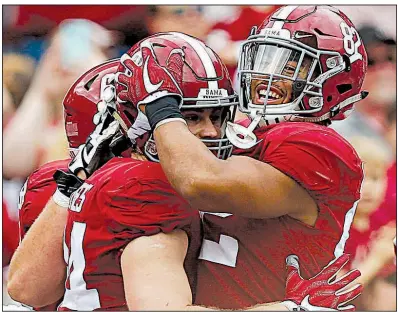  ?? AP/BRYNN ANDERSON ?? Alabama tight end Hale Hentges (left) celebrates with Irv Smith Jr. after scoring a touchdown earlier this season. The Crimson Tide was selected over Ohio State for the final spot in the College Football Playoff and will play Clemson on Jan. 1 in the...