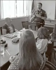  ?? K.T. Mckee ?? Rome police officer David Mcguire speaks to the Floyd County Chapter of the Georgia Council of the Blind on Tuesday about pedestrian safety as they celebrate National White Cane Safety Day at Landmark Restaurant.