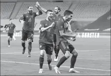  ?? REUTERS ?? Ferran Torres ( front) celebrates scoring Spain’s second goal with Sergi Roberto during Tuesday’s 6- 0 UEFA Nations League rout of Germany in Seville, Spain.