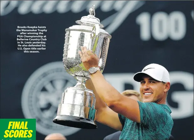  ?? Charlie Riedel/The Associated Press ?? Brooks Koepka hoists the Wanamaker Trophy after winning the PGA Championsh­ip at Bellerive Country Club in St. Louis yesterday. He also defended his U.S. Open title earlier this season.