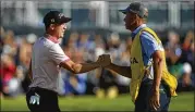  ?? ERIC GAY/AP ?? Justin Thomas celebrates Sunday with his caddie Jim “Bones” Mackay after winning the PGA Championsh­ip golf tournament in a playoff against Will Zalatoris at Southern Hills Country Club in Tulsa, Okla.